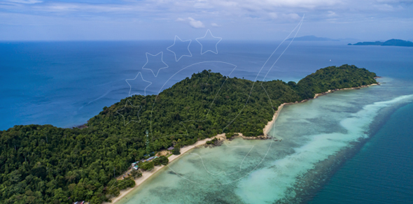 Aerial view of a forested tropical island with sandy beach, turquoise reef shallows and deep blue sea